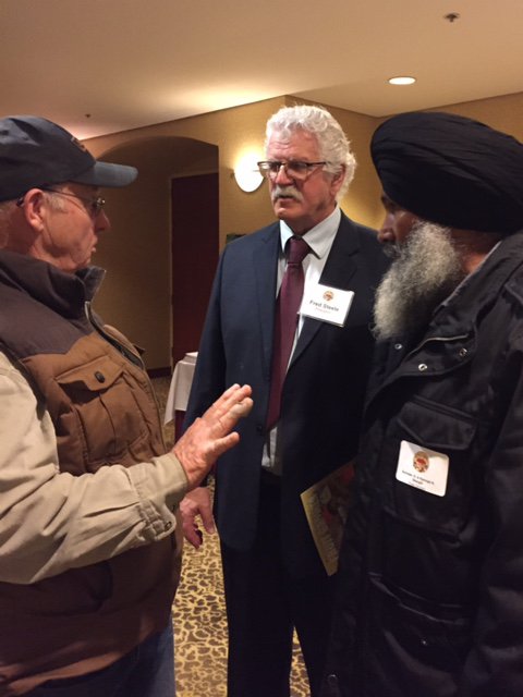 Fred Steele conversing with fellow fruit growers after the BCFGA election 2015